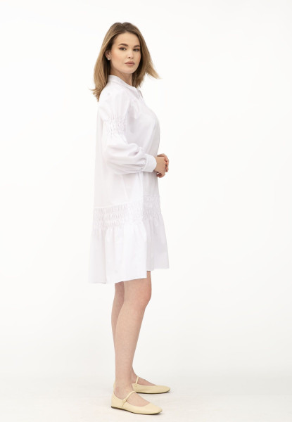 Біле жіноче плаття А-силуету з коміром-стійкою та рюшами Лам'є Біле жіноче плаття А-силуету з коміром-стійкою та рюшами Лам'є